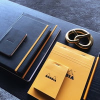 Schrijfblok Rhodia A5 lijn met kantlijn 80 vel 80gr oranje